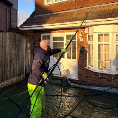 Low-pressure roof cleaning on tiled roof in Derby – moss and lichen removal